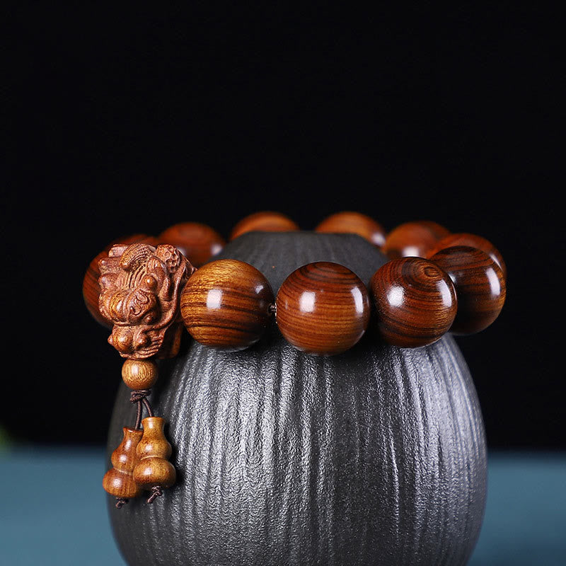 KarmaRipple's Rosewood Green Sandalwood Small Leaf Red Sandalwood Agarwood Dragon Carved Protection Bracelet p1