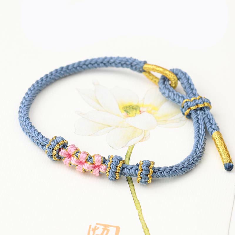 KarmaRipple's Handmade Three Peach Blossoms Fortune Eight Strands Woven String Bracelet p1