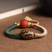 KarmaRipple's Handmade Tibetan Nine-Eye Dzi Bead Wealth Rope Bracelet